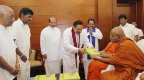 Book titled " Siri Dalada Harasaraniya "  presented to President