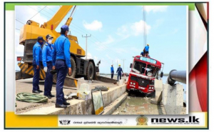 Navy assists to lift SLTB bus slipped off to lagoon at Ponnalai area, Jaffna