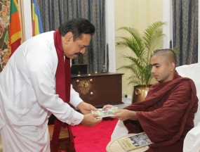 The book titled " Budun Wedi Maga" presented to President
