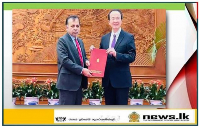 Dr. Palitha  Kohona presents copy of the credentials to the DG of the Department of Protocol of the Ministry of Foreign Affairs of China