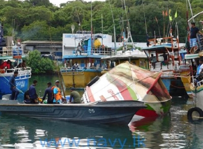 Navy rescue a fisherman on a distressed fishing trawler