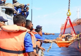 Navy renders assistance to transfer a mariner ashore for treatment